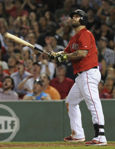 Jul 31, 2015; Boston, MA, USA; Boston Red Sox first baseman Mike Napoli (12) watches his home run land in the green monster seats during the seventh inning against the Tampa Bay Rays at Fenway Park. Mandatory Credit: Bob DeChiara-USA TODAY Sports