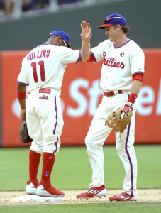 Aug 24, 2014; Philadelphia, PA, USA; Philadelphia Phillies shortstop Jimmy Rollins (11) and second baseman Chase Utley (26) celebrate the win against the St. Louis Cardinals at Citizens Bank Park. The Phillies defeated the Cardinals, 7-1. Mandatory Credit: Eric Hartline-USA TODAY Sports