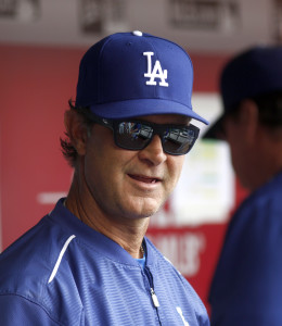Aug 27, 2015; Cincinnati, OH, USA; Los Angeles Dodgers manager Don Mattingly gets ready in the dugout at the beginning of a game with Cincinnati Reds at Great American Ball Park. Mandatory Credit: David Kohl-USA TODAY Sports