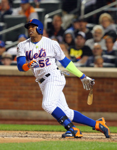 Oct 13, 2015; New York City, NY, USA; New York Mets left fielder Yoenis Cespedes (52) hits an infield single against the Los Angeles Dodgers during the seventh inning in game four of the NLDS at Citi Field. Mandatory Credit: Brad Penner-USA TODAY Sports