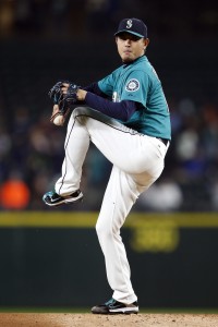 Oct 2, 2015; Seattle, WA, USA; Seattle Mariners starting pitcher Hisashi Iwakuma (18) throws out a pitch in the first inning against the Oakland Athletics at Safeco Field. Mandatory Credit: Jennifer Buchanan-USA TODAY Sports