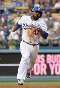 Jul 6, 2015; Los Angeles, CA, USA; Los Angeles Dodgers second baseman Howie Kendrick (47) rounds second base on a triple in the first inning against the Philadelphia Phillies at Dodger Stadium. Mandatory Credit: Kirby Lee-USA TODAY Sports