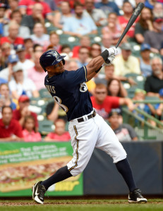 Aug 9, 2015; Milwaukee, WI, USA; Milwaukee Brewers left fielder Khris Davis (18) hits a two run home run in the eighth inning against the St. Louis Cardinals at Miller Park. Mandatory Credit: Benny Sieu-USA TODAY Sports