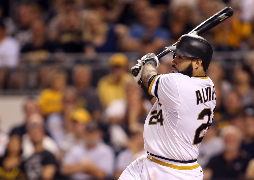 Pittsburgh Pirates Pedro Alvarez tosses his bat and walks to first