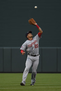 Jul 11, 2015; Baltimore, MD, USA; Washington Nationals shortstop Ian Desmond (20) catches a fly ball hit by Baltimore Orioles center fielder Adam Jones (not pictured) during the first inning at Oriole Park at Camden Yards. Mandatory Credit: Tommy Gilligan-USA TODAY Sports