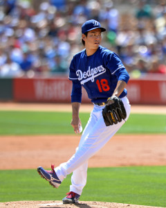 Mar 21, 2016; Phoenix, AZ, USA; Los Angeles Dodgers starting pitcher Kenta Maeda (18) pitches during the first inning against the Seattle Mariners at Camelback Ranch. Mandatory Credit: Jake Roth-USA TODAY Sports