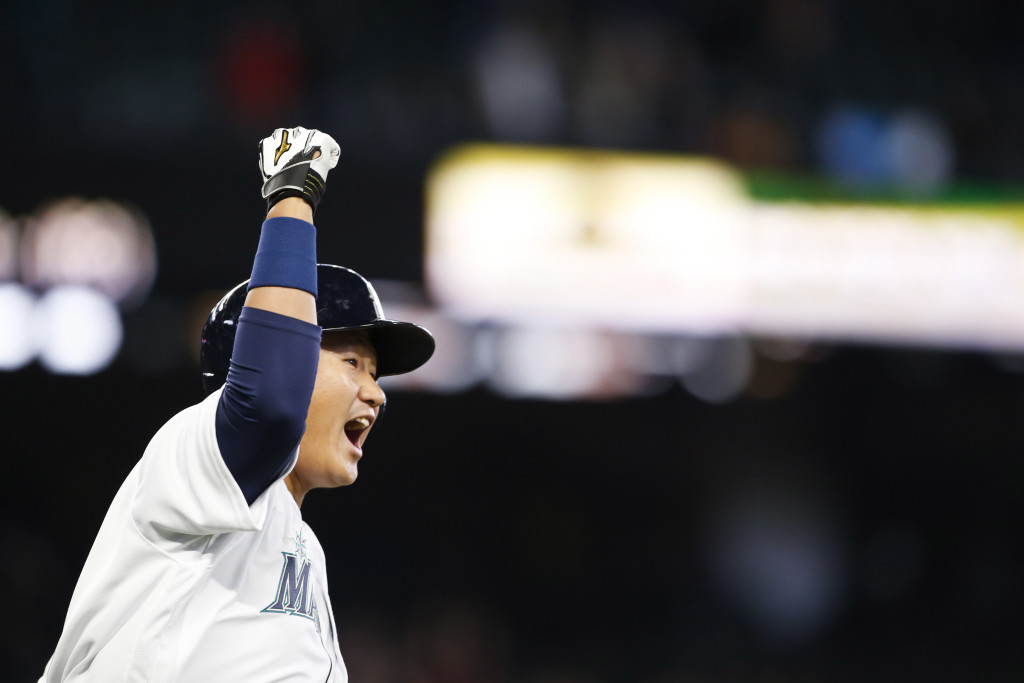 Seattle Mariners first baseman Dae-Ho Lee bats reacts after