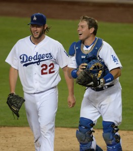 Sep 24, 2014; Los Angeles, CA, USA; Los Angeles Dodgers starting pitcher Clayton Kershaw (22) and Los Angeles Dodgers catcher A.J. Ellis (17) walk off the field after the last out of the eighth inning against the San Francisco Giants at Dodger Stadium. The Los Angeles Dodgers defeated the San Francisco Giants 9-1 to clinch the NL West Division Championship. Mandatory Credit: Jayne Kamin-Oncea-USA TODAY Sports