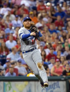 Aug 18, 2016; Philadelphia, PA, USA; Los Angeles Dodgers third baseman Justin Turner (10) throws to first for an out against the Philadelphia Phillies at Citizens Bank Park. Mandatory Credit: Bill Streicher-USA TODAY Sports