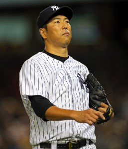 Sep 9, 2014; Bronx, NY, USA; New York Yankees starting pitcher Hiroki Kuroda (18) reacts after giving up a run against the Tampa Bay Rays during the third inning at Yankee Stadium. Mandatory Credit: Adam Hunger-USA TODAY Sports