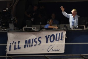 Sep 23, 2016; Los Angeles, CA, USA; American broadcaster Vin Scully reacts as a banner is unveiled during the seventh inning stretch during the game between the Los Angeles Dodgers and the Colorado Rockies at Dodger Stadium. Mandatory Credit: Kelvin Kuo-USA TODAY Sports