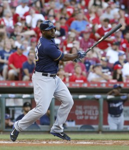 Jul 16, 2016; Cincinnati, OH, USA; Milwaukee Brewers first baseman Chris Carter hits an RBI double against the Cincinnati Reds during the first inning at Great American Ball Park. Mandatory Credit: David Kohl-USA TODAY Sports