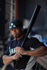 February 22, 2013; Peoria, AZ, USA; Seattle Mariners left fielder Eric Thames (10) takes practice swings in the dugout during the fourth inning against the San Diego Padres at Peoria Sports Complex. Mandatory Credit: Kyle Terada-USA TODAY Sports