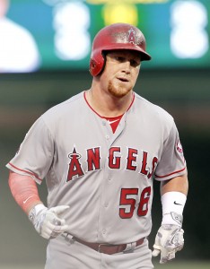 Aug 9, 2016; Chicago, IL, USA; Los Angeles Angels right fielder Kole Calhoun (56) rounds third base after hitting a solo home run during the first inning of the game against the Chicago Cubs at Wrigley Field. Mandatory Credit: Caylor Arnold-USA TODAY Sports