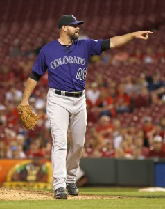 Apr 18, 2016; Cincinnati, OH, USA; Colorado Rockies relief pitcher Boone Logan points to home during the ninth inning against the Cincinnati Reds at Great American Ball Park. The Rockies won 5-1. Mandatory Credit: David Kohl-USA TODAY Sports
