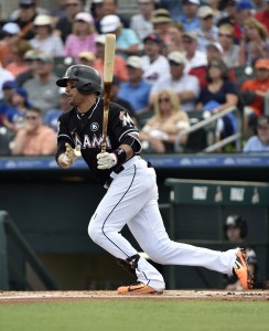 Feb 28, 2017; Jupiter, FL, USA; Miami Marlins third baseman Martin Prado (14) at bat against the New York Mets during a spring training game at Roger Dean Stadium. Mandatory Credit: Steve Mitchell-USA TODAY Sports