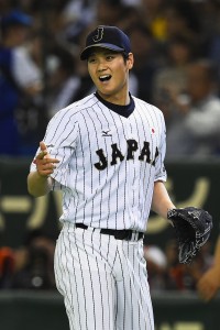 TOKYO, JAPAN - NOVEMBER 19: Starting pitcher Shohei Otani #16 of Japan reacts after the top of sixth inning during the WBSC Premier 12 semi final match between South Korea and Japan at the Tokyo Dome on November 19, 2015 in Tokyo, Japan. (Photo by Masterpress/Getty Images)