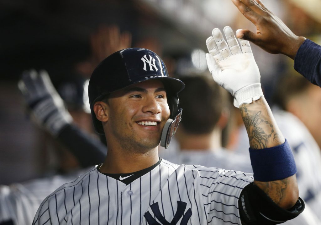 New York Yankees' Gleyber Torres (25) is congratulated by Josh