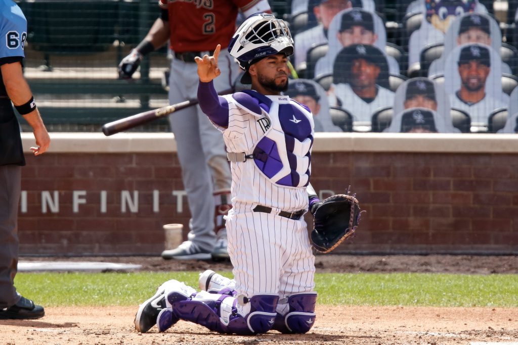 Here to help: Rockies catcher Elias Diaz extends a hand to his