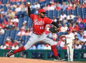 Pitcher Mychal Givens throws during the first day of workouts for