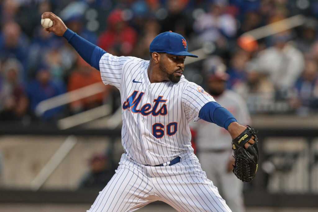 Pitcher Mychal Givens throws during the first day of workouts for