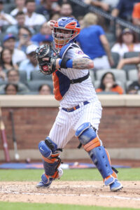 New York Mets relief pitcher Trevor May, left, and catcher Tomas Nido,  right, hug after the first baseball game of a doubleheader against the  Washington Nationals, Saturday, June 19, 2021, in Washington.