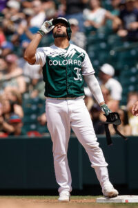 Here to help: Rockies catcher Elias Diaz extends a hand to his