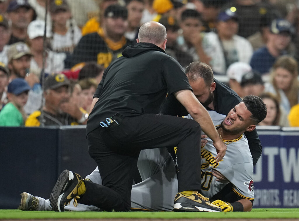 Pittsburgh Pirates' Tucupita Marcano, left, avoids the slide of